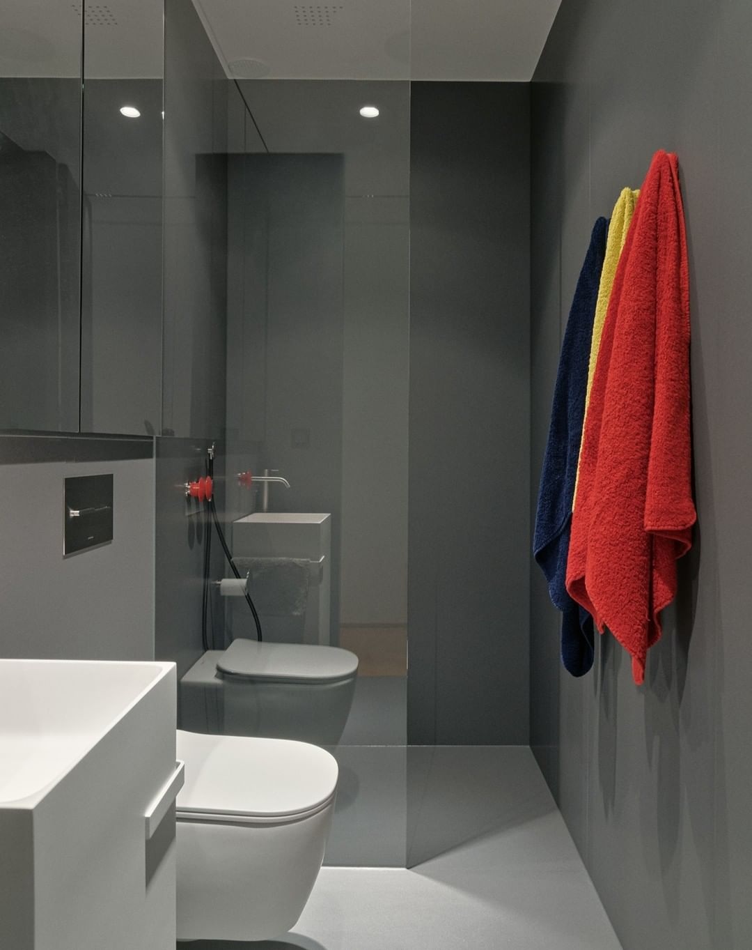 Bright and Bold towels for grey bath