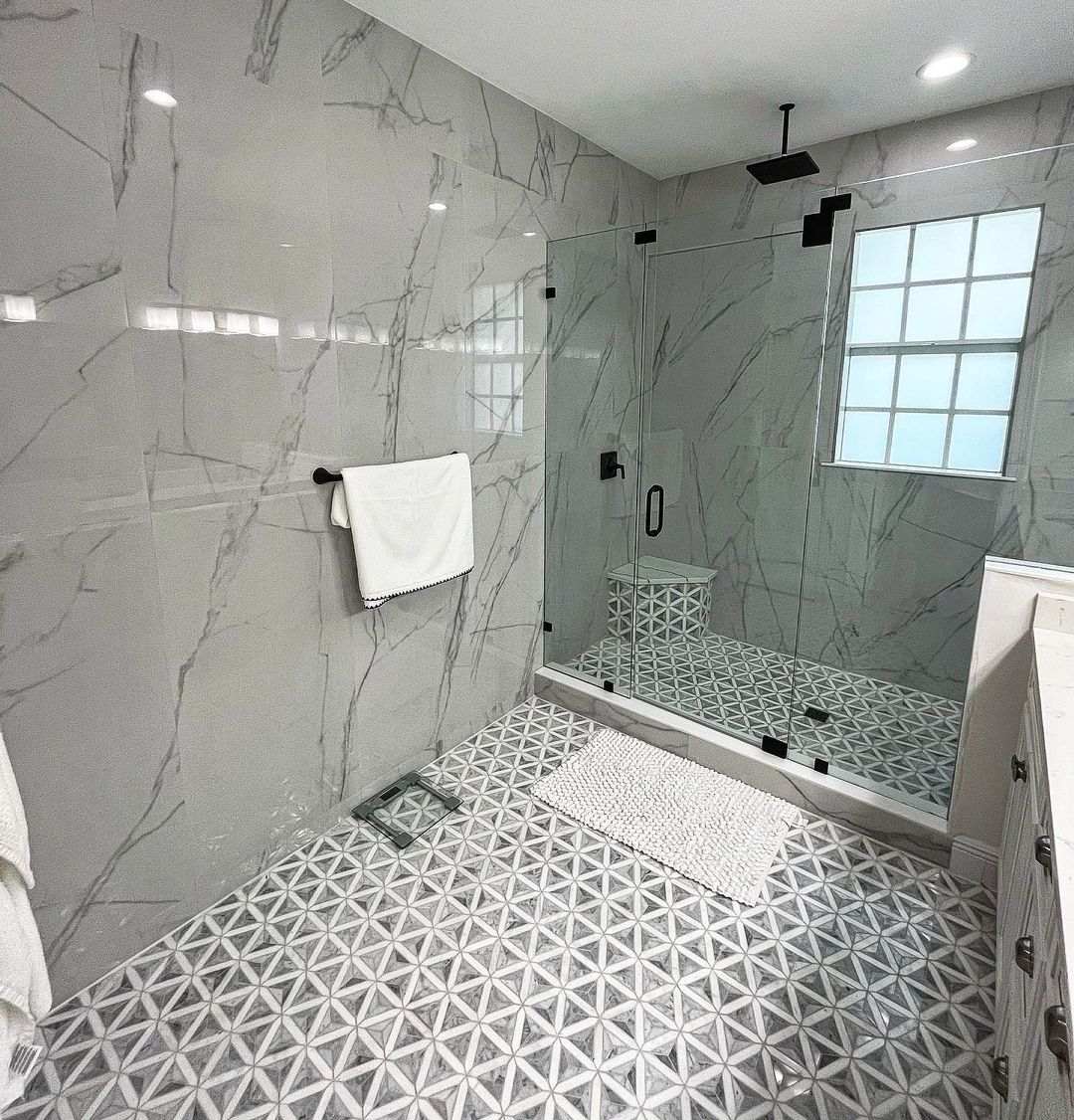 same floor and wall tiles in bathroom