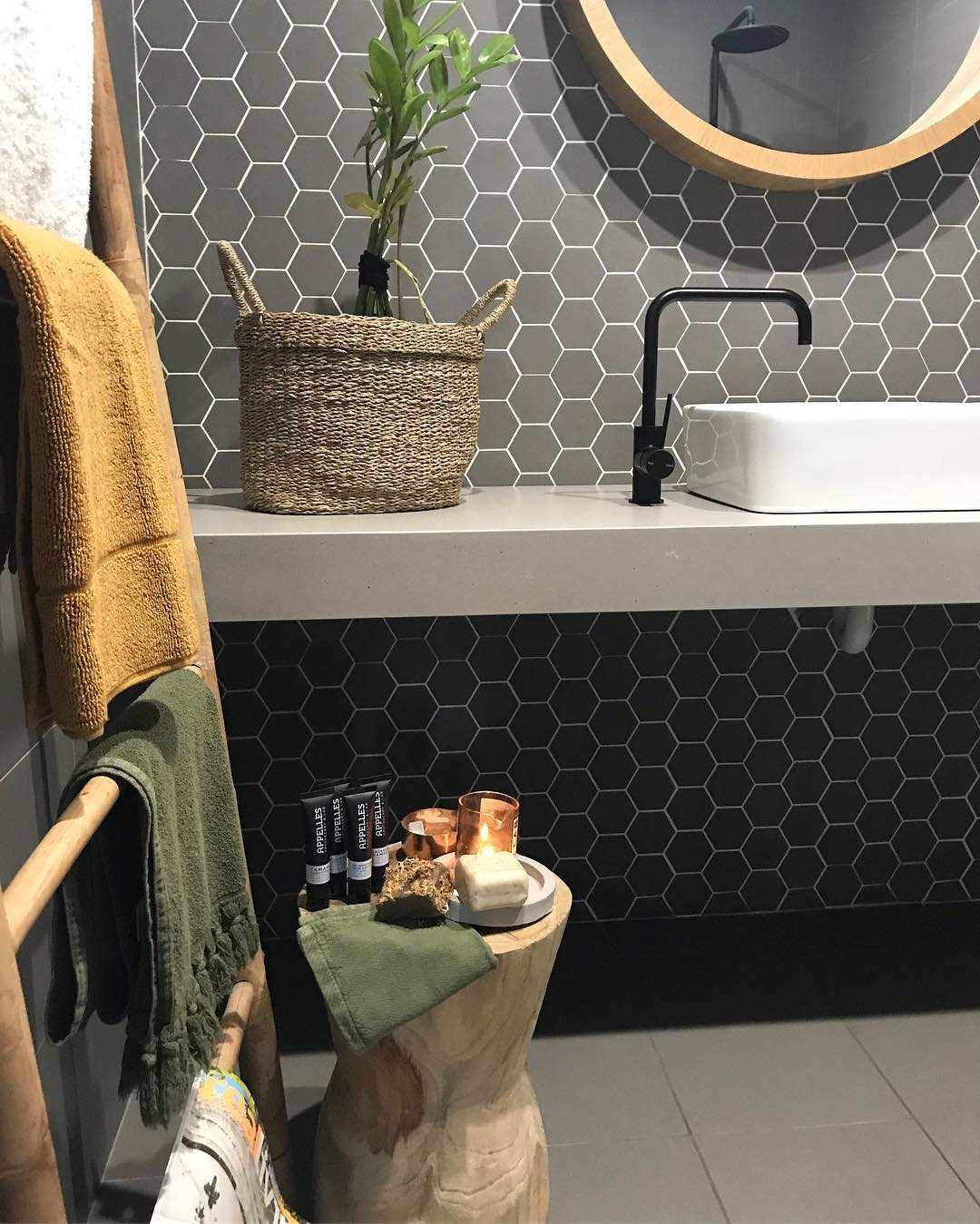 Yellow and olive towels for gray bathroom